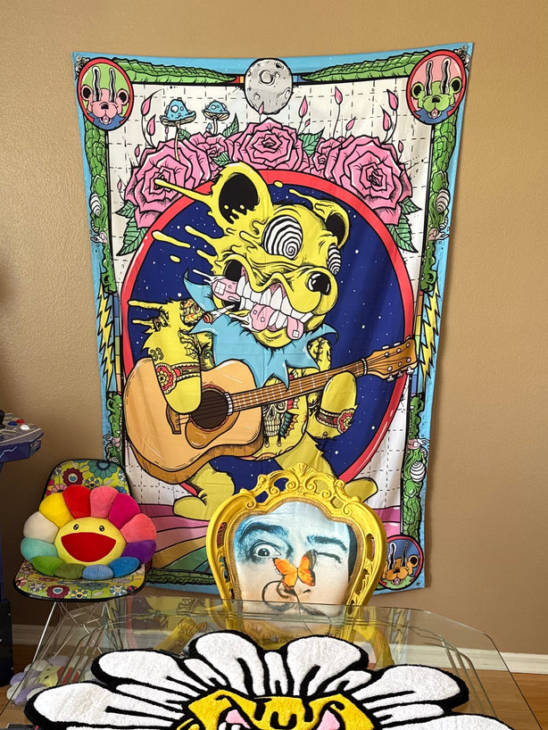 Colorful room interior with posters, a mirror, and decorative items on a wall.