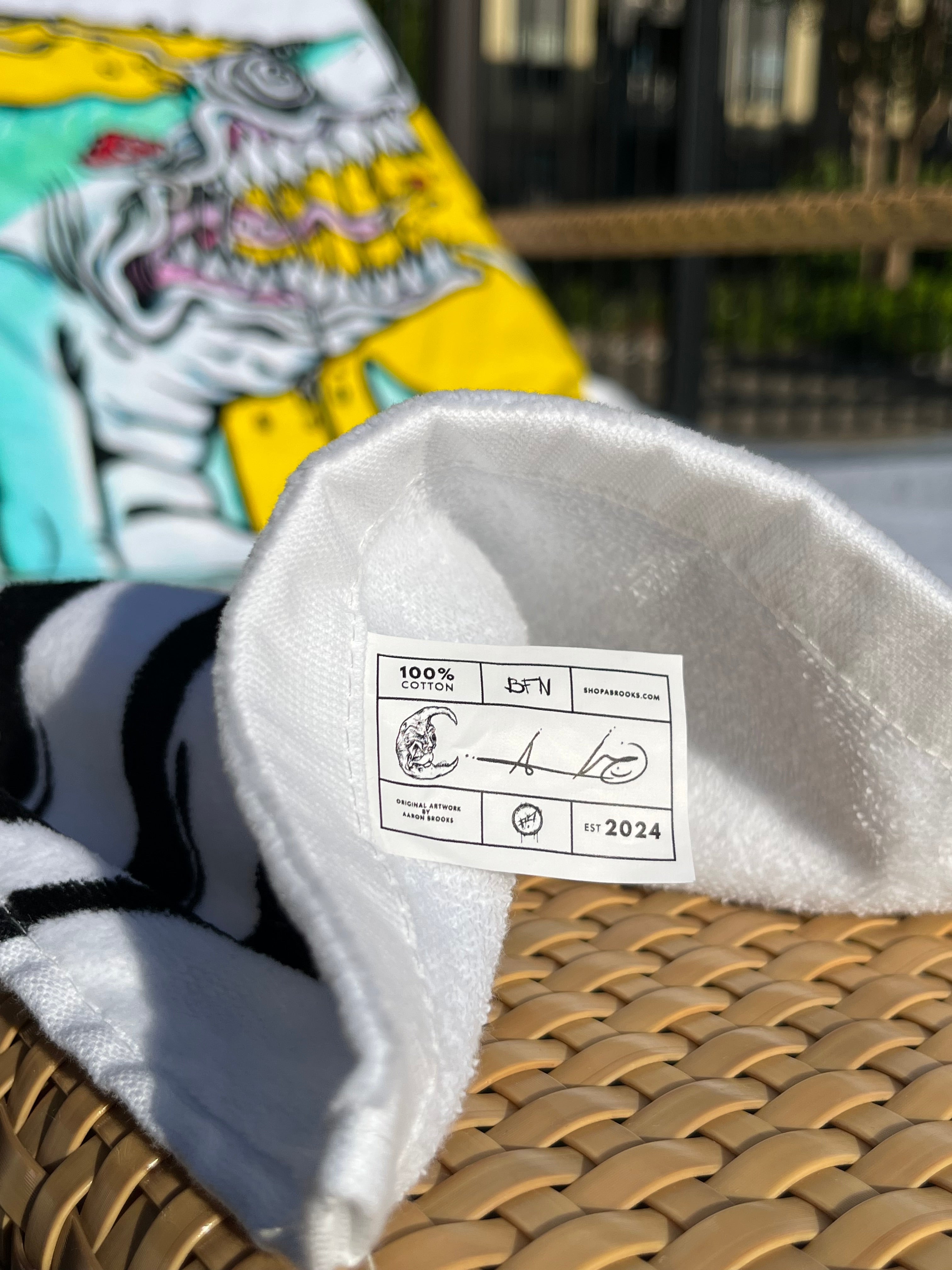 Aaron Brooks’ “Spun Sea Puppy” Beach Towel